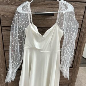Elegant White Dress with Sheer Polka Dot Sleeves